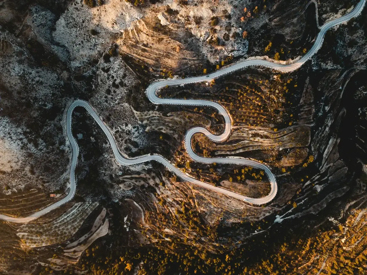 Winding mountain road, aerial view